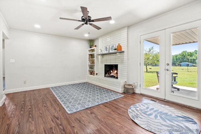 18094 S 461st E Ave, Porter, OK 74454 - unfurnished living room featuring ceiling fan, wood finished floors, a fireplace, baseboards, and french doors