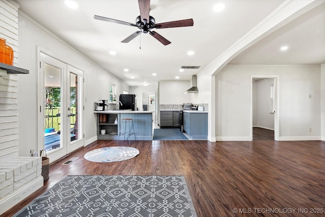 18094 S 461st E Ave, Porter, OK 74454 - living room featuring dark wood-style flooring, baseboards, a ceiling fan, arched walkways, and recessed lighting