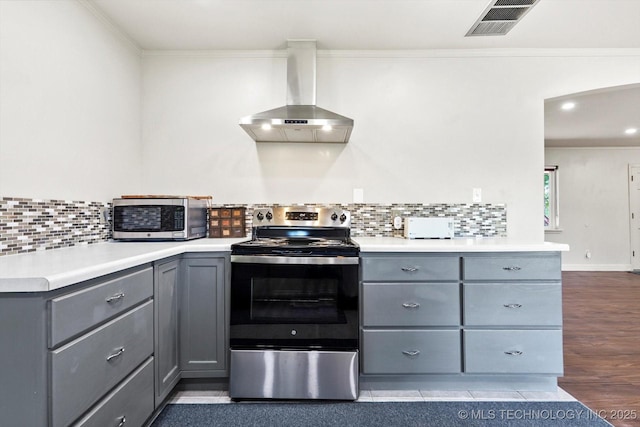 18094 S 461st E Ave, Porter, OK 74454 - kitchen with stainless steel appliances, gray cabinetry, wall chimney exhaust hood, crown molding, and backsplash