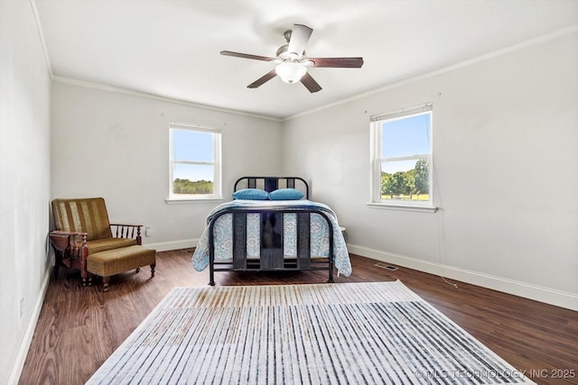 18094 S 461st E Ave, Porter, OK 74454 - bedroom featuring multiple windows, baseboards, wood finished floors, ornamental molding, and ceiling fan