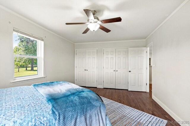 18094 S 461st E Ave, Porter, OK 74454 - bedroom featuring multiple closets, wood finished floors, baseboards, ornamental molding, and ceiling fan