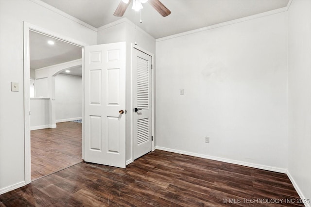18094 S 461st E Ave, Porter, OK 74454 - unfurnished bedroom featuring crown molding, arched walkways, dark wood-type flooring, baseboards, and a ceiling fan