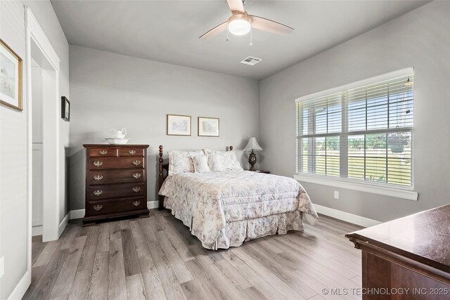 8323 S 2nd W, Muskogee, OK 74401 - bedroom featuring baseboards, wood finished floors, and a ceiling fan