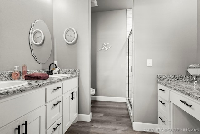 8323 S 2nd W, Muskogee, OK 74401 - full bath with toilet, double vanity, wood finished floors, and a shower stall