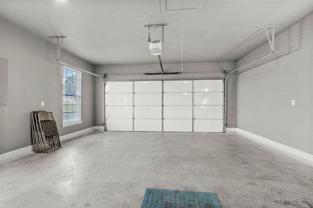 8323 S 2nd W, Muskogee, OK 74401 - garage featuring a garage door opener and baseboards