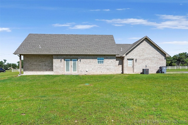 8323 S 2nd W, Muskogee, OK 74401 - rear view of property with cooling unit, french doors, brick siding, and a shingled roof