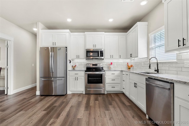 8315 S 2nd W, Muskogee, OK 74401 - kitchen with stainless steel appliances, a sink, white cabinetry, tasteful backsplash, and recessed lighting