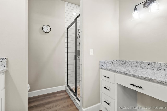 8315 S 2nd W, Muskogee, OK 74401 - full bath featuring baseboards, a shower stall, toilet, and wood finished floors