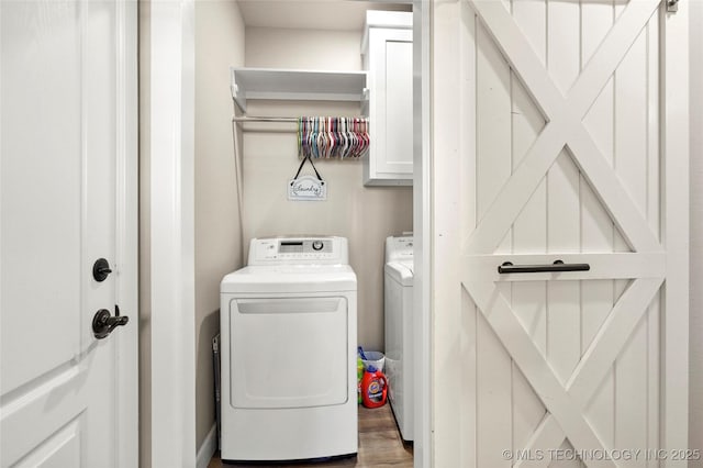 8315 S 2nd W, Muskogee, OK 74401 - laundry area featuring cabinet space, washer and dryer, and wood finished floors
