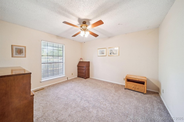 13200 E 130th St S, Broken Arrow, OK 74011 - unfurnished bedroom featuring carpet floors, a textured ceiling, ceiling fan, and baseboards