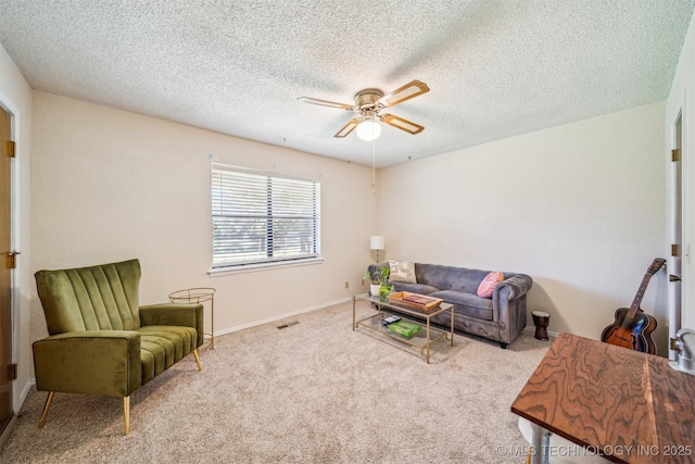 13200 E 130th St S, Broken Arrow, OK 74011 - living area featuring a ceiling fan, carpet floors, a textured ceiling, and baseboards