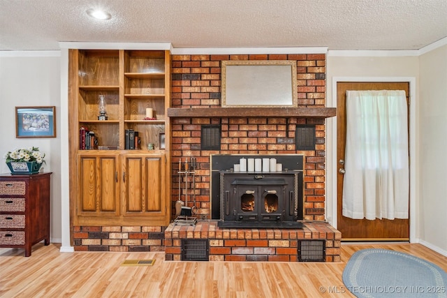 13200 E 130th St S, Broken Arrow, OK 74011 - living area with a textured ceiling, wood finished floors, crown molding, and baseboards