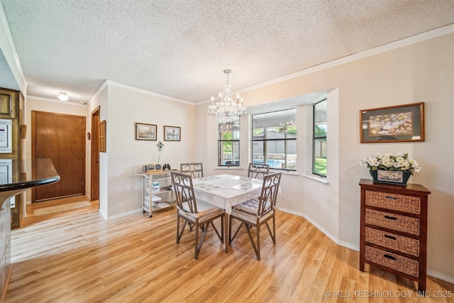 13200 E 130th St S, Broken Arrow, OK 74011 - dining area featuring a textured ceiling, a chandelier, light wood finished floors, crown molding, and baseboards