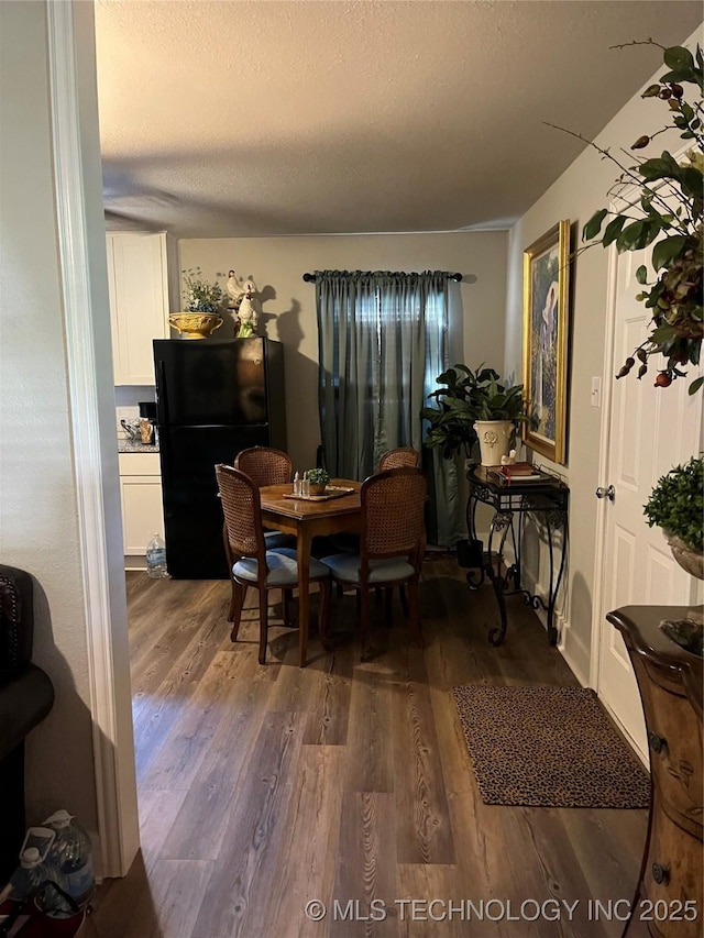 417 S 16th Ave, Durant, OK 74701 - dining space with dark wood finished floors and a textured ceiling