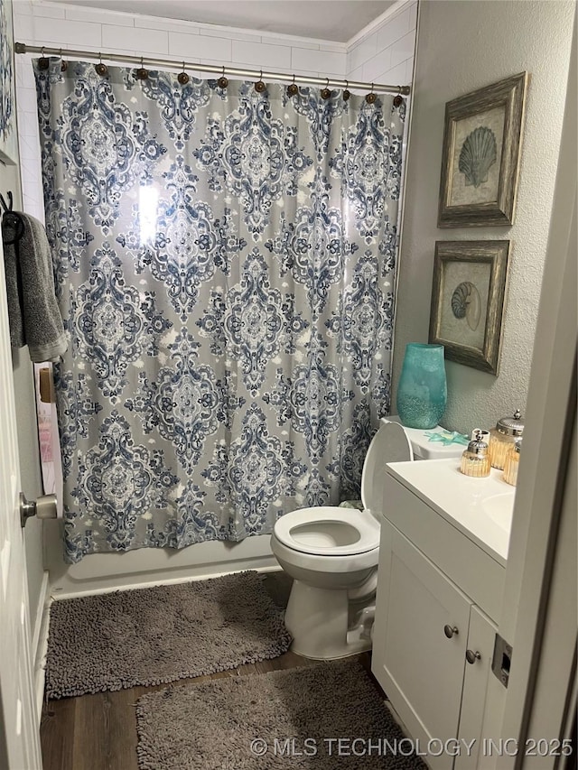417 S 16th Ave, Durant, OK 74701 - full bath featuring toilet, vanity, shower / tub combo, and wood finished floors