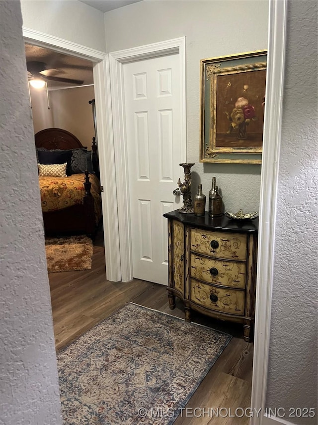 417 S 16th Ave, Durant, OK 74701 - hall with wood finished floors and a textured wall