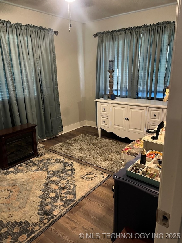 417 S 16th Ave, Durant, OK 74701 - bedroom with dark wood-style flooring and baseboards