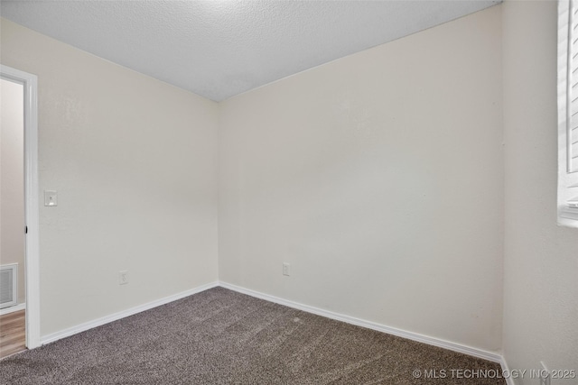 401 E 25th St, Okmulgee, OK 74447 - empty room with carpet flooring and baseboards