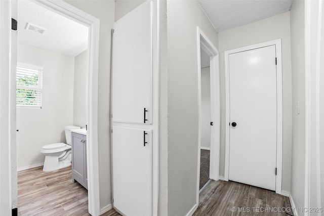 401 E 25th St, Okmulgee, OK 74447 - hall with light wood finished floors and baseboards