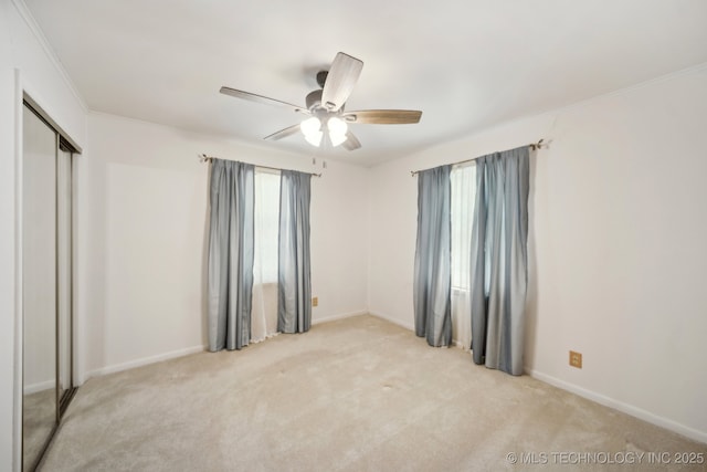 10925 E 4th St, Tulsa, OK 74128 - empty room with light colored carpet, baseboards, ceiling fan, and crown molding