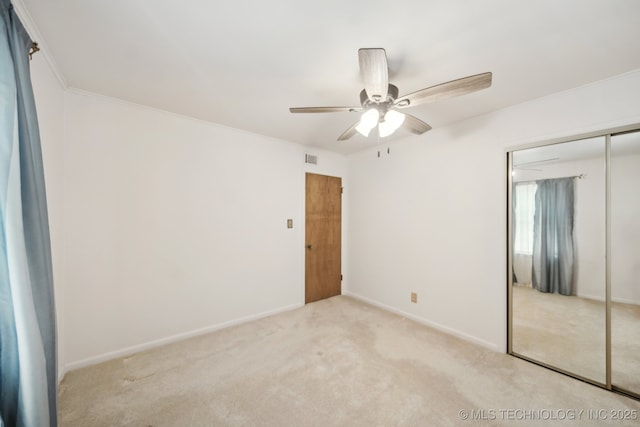 10925 E 4th St, Tulsa, OK 74128 - unfurnished bedroom with a closet, carpet, baseboards, ornamental molding, and ceiling fan