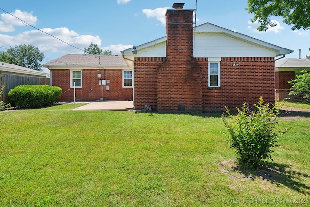 10925 E 4th St, Tulsa, OK 74128 - back of house with a patio, a chimney, and brick siding