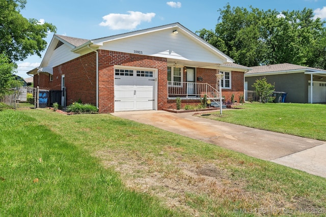 10925 E 4th St, Tulsa, OK 74128 - ranch-style house with a garage, brick siding, driveway, and covered porch