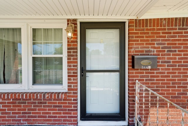 10925 E 4th St, Tulsa, OK 74128 - doorway to property featuring brick siding