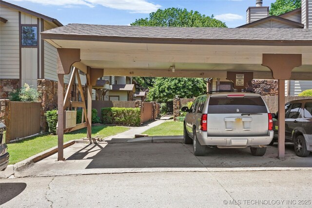 6374 S 80th E Ave Unit A, Tulsa, OK 74133 - view of car parking with a carport
