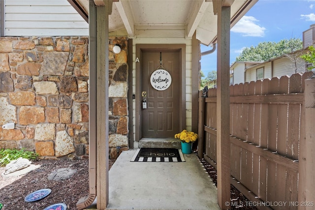 6374 S 80th E Ave Unit A, Tulsa, OK 74133 - doorway to property with stone siding