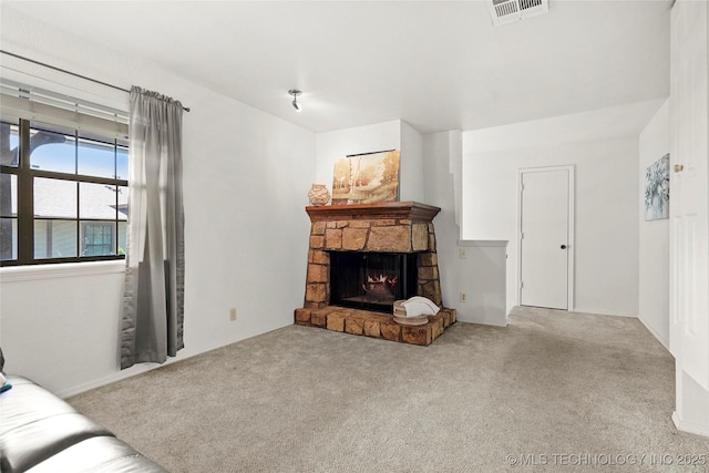 6374 S 80th E Ave Unit A, Tulsa, OK 74133 - living area with carpet flooring and a stone fireplace
