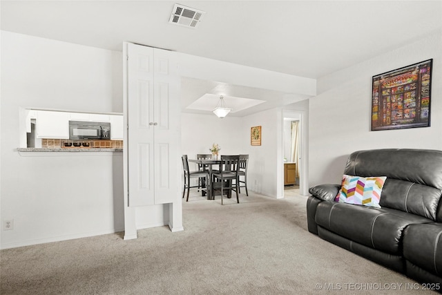 6374 S 80th E Ave Unit A, Tulsa, OK 74133 - carpeted living area with baseboards