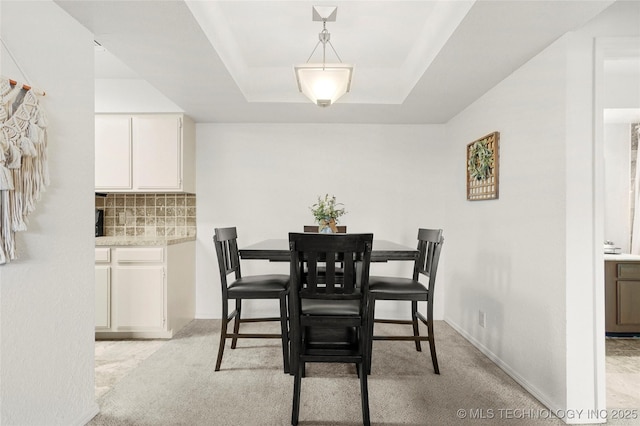 6374 S 80th E Ave Unit A, Tulsa, OK 74133 - dining space with light colored carpet and a raised ceiling