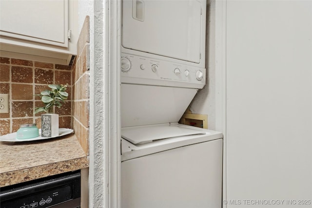 6374 S 80th E Ave Unit A, Tulsa, OK 74133 - washroom featuring stacked washing machine and dryer