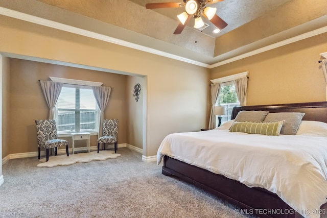 9512 N 144th E Ave, Owasso, OK 74055 - bedroom with carpet floors, baseboards, a tray ceiling, and ceiling fan