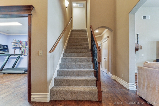9512 N 144th E Ave, Owasso, OK 74055 - stairs featuring arched walkways, wood finished floors, ornamental molding, and baseboards