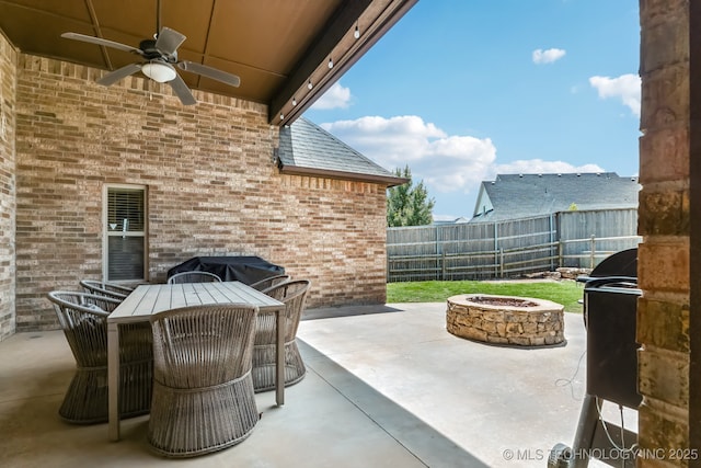 9512 N 144th E Ave, Owasso, OK 74055 - view of patio with an outdoor fire pit, ceiling fan, grilling area, and outdoor dining area