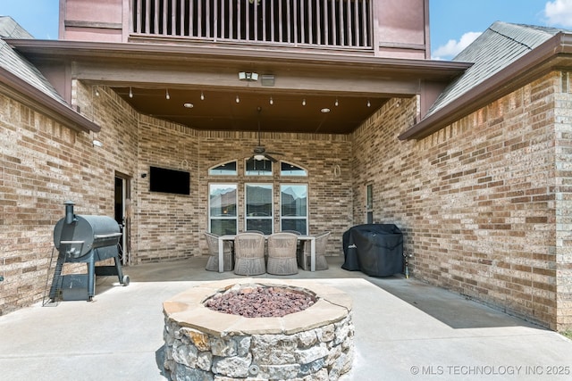 9512 N 144th E Ave, Owasso, OK 74055 - view of patio / terrace with ceiling fan, a balcony, a grill, and outdoor dining space