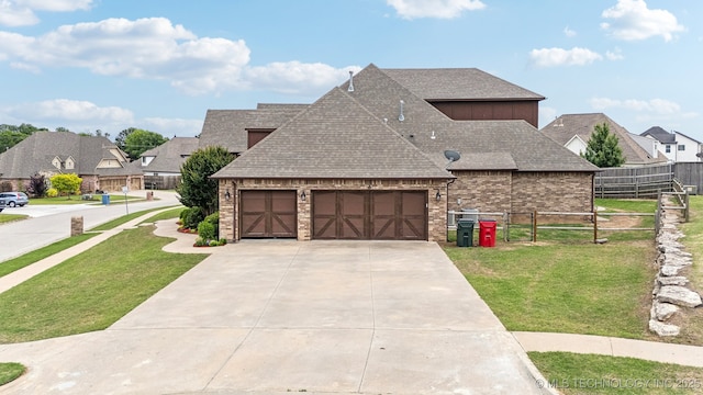 9512 N 144th E Ave, Owasso, OK 74055 - view of front of property featuring driveway, a garage, a shingled roof, and brick siding