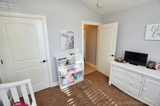 2570 Ambers Way, Tahlequah, OK 74464 - bedroom featuring lofted ceiling, dark carpet, and dark tile patterned flooring