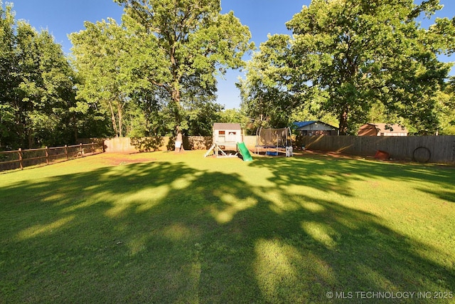 2570 Ambers Way, Tahlequah, OK 74464 - view of yard featuring a playground, a trampoline, and view of scattered trees