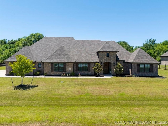10406 N 86th E Ave, Owasso, OK 74055 - french country inspired facade featuring a front lawn and roof with shingles