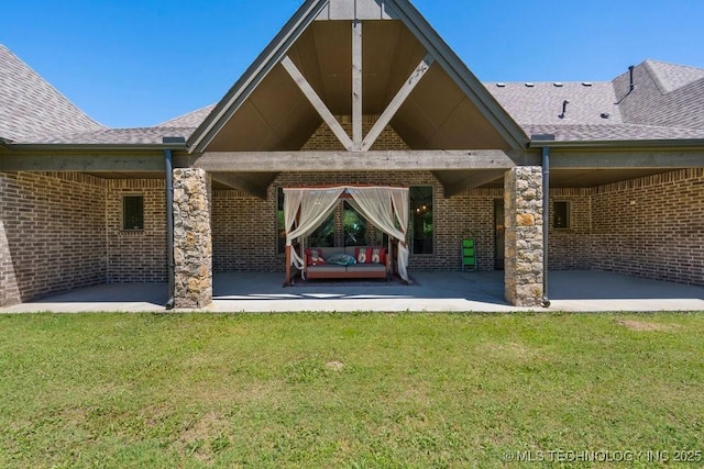 10406 N 86th E Ave, Owasso, OK 74055 - back of property with a patio, a yard, brick siding, and a shingled roof