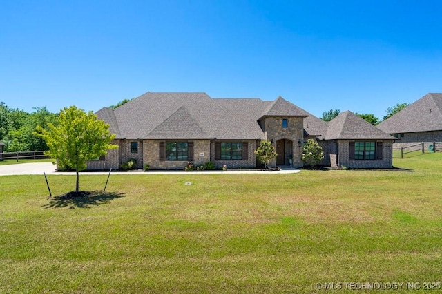 10406 N 86th E Ave, Owasso, OK 74055 - french country home featuring brick siding