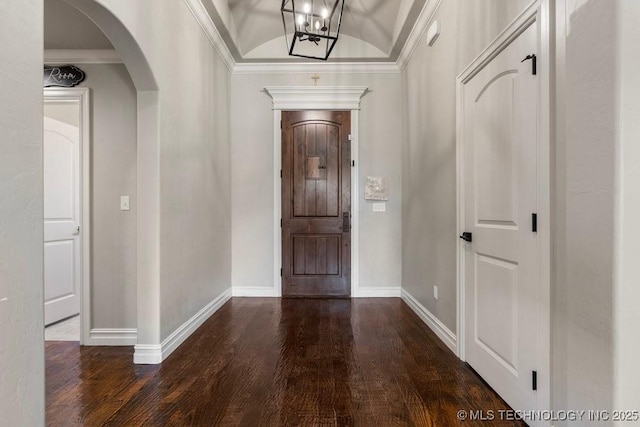 10406 N 86th E Ave, Owasso, OK 74055 - entryway featuring wood finished floors, baseboards, arched walkways, crown molding, and a chandelier