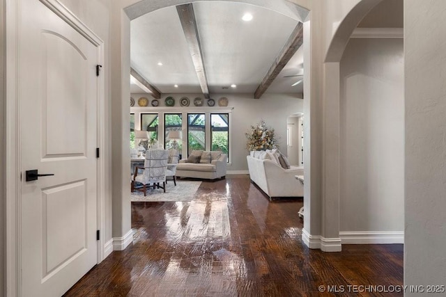 10406 N 86th E Ave, Owasso, OK 74055 - living area featuring arched walkways, baseboards, beam ceiling, wood-type flooring, and a ceiling fan