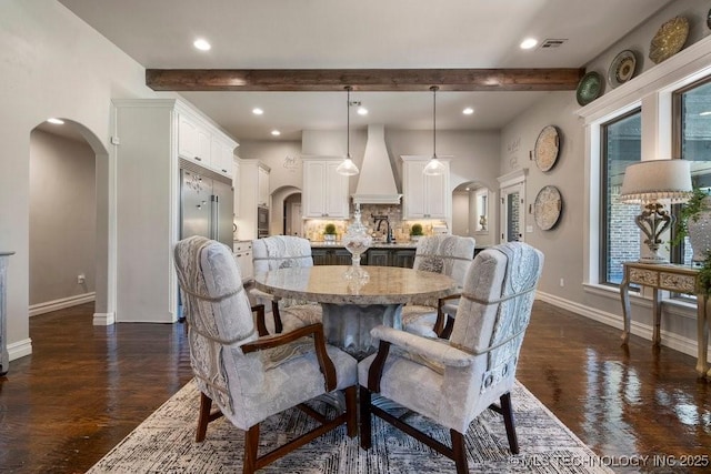 10406 N 86th E Ave, Owasso, OK 74055 - dining space featuring arched walkways, baseboards, beam ceiling, dark wood finished floors, and recessed lighting