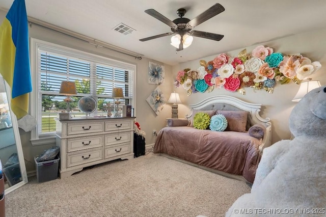 10406 N 86th E Ave, Owasso, OK 74055 - bedroom featuring multiple windows, light colored carpet, a ceiling fan, and baseboards