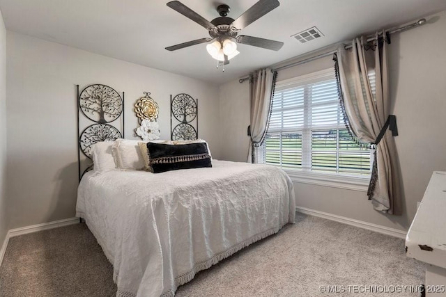 10406 N 86th E Ave, Owasso, OK 74055 - bedroom featuring baseboards, light colored carpet, and a ceiling fan