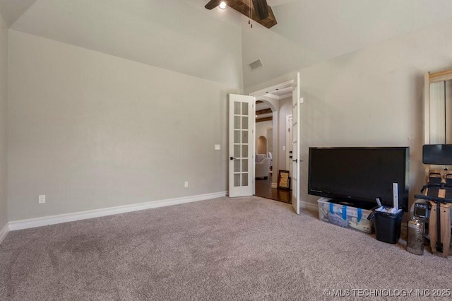 10406 N 86th E Ave, Owasso, OK 74055 - carpeted living area featuring a ceiling fan, french doors, high vaulted ceiling, baseboards, and arched walkways